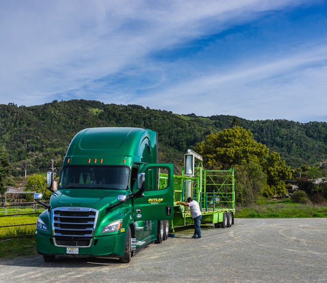 Green Truck on a Car Park in a Green Landscape