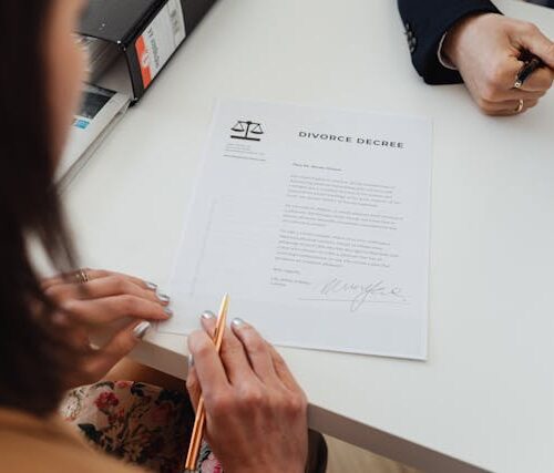 A Woman Reading a Divorce Decree Paper
