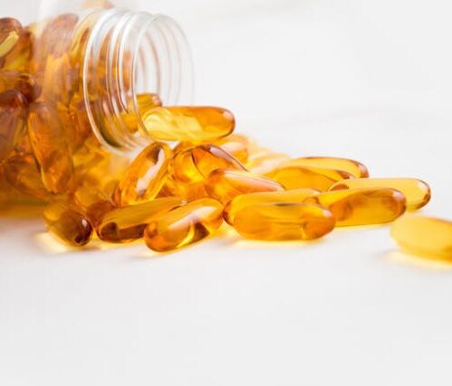 Spilled Bottle of Yellow Capsule Pills