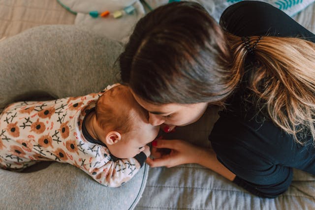 woman taking care of baby