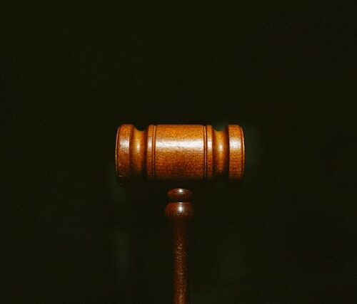 brown wooden stand with black background