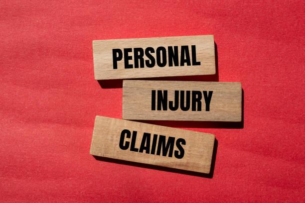 personal injury claims written in wood blocks